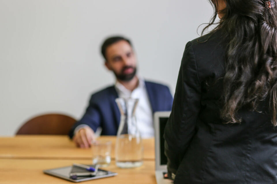 good supervisor woman having a chat with a man in a suit